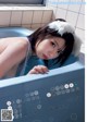 A calendar with a picture of a woman in a bathtub.