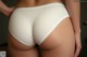 A close up of a woman's butt in a white panties.